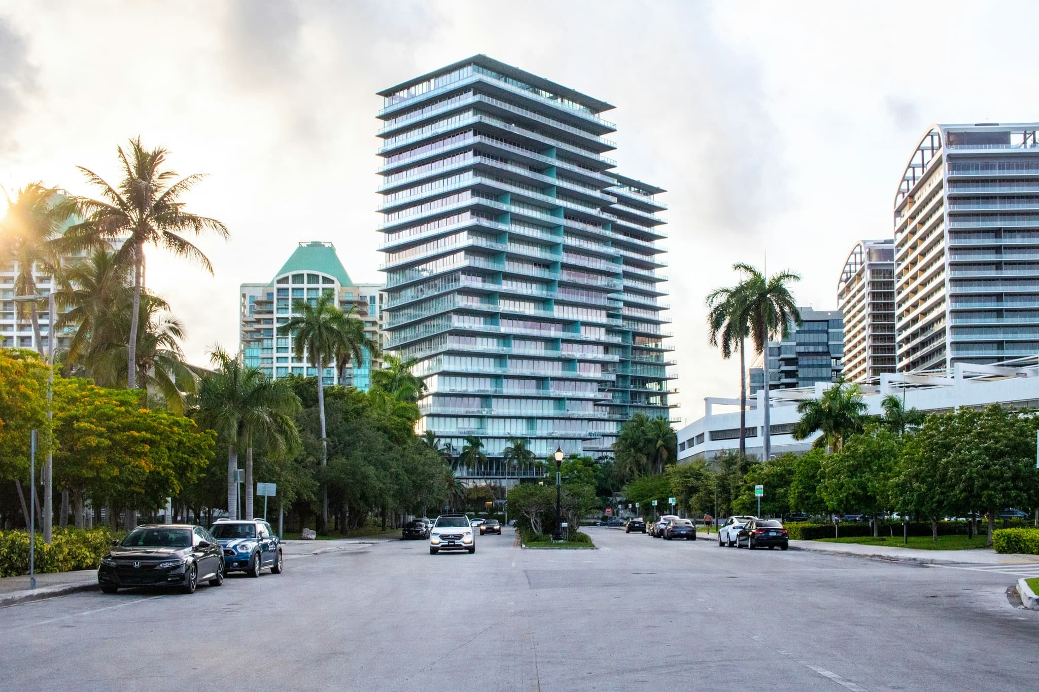Sunlit South Florida street with modern high-rises and palms representing Universal Investigations Agency local coverage